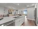 Spacious kitchen island with stainless steel dishwasher, and view of the formal dining and living areas at 270 17Th Nw St # 2804, Atlanta, GA 30363