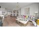 Open-concept living and dining area featuring hardwood floors and an abundance of natural light at 270 17Th Nw St # 2804, Atlanta, GA 30363