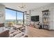 Spacious living room featuring a large window, hardwood flooring, and tasteful furnishings at 270 17Th Nw St # 2804, Atlanta, GA 30363