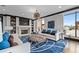 Cozy lounge area with fireplace, bookshelves, and a view to the outside terrace at 270 17Th Nw St # 2804, Atlanta, GA 30363