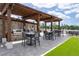 Outdoor grilling area featuring two grills, seating, pergola, and views of city skyline at 270 17Th Nw St # 2804, Atlanta, GA 30363