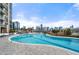 Outdoor pool with city skyline view, complemented by lounge seating and landscaping at 270 17Th Nw St # 2804, Atlanta, GA 30363