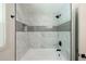 Bathroom showcasing tiled shower with modern fixtures at 3219 W Manor Ln, Atlanta, GA 30311