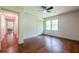 Bedroom featuring hardwood floors, closet, and windows with natural light at 3219 W Manor Ln, Atlanta, GA 30311