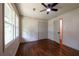 Bedroom showcasing hardwood floors, closet, and windows with natural light at 3219 W Manor Ln, Atlanta, GA 30311