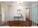 Well-lit foyer featuring hardwood floors, neutral walls, and a stylish console table at 3219 W Manor Ln, Atlanta, GA 30311