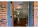 Stylish foyer featuring gleaming hardwood floors and an open view into the living spaces at 3219 W Manor Ln, Atlanta, GA 30311