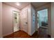 Hallway featuring hardwood floors and access to the bathroom and living areas at 3219 W Manor Ln, Atlanta, GA 30311