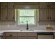 Kitchen with lots of counter space and cabinets with a great view from window at 3219 W Manor Ln, Atlanta, GA 30311