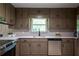The kitchen features stainless appliances, undermount sink and window view with ample cabinet space at 3219 W Manor Ln, Atlanta, GA 30311