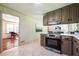 Cozy kitchen with light tile flooring and a doorway to an adjoining living space at 3219 W Manor Ln, Atlanta, GA 30311
