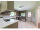 A well-lit kitchen with stainless steel appliances and quartz countertops, next to a doorway at 3219 W Manor Ln, Atlanta, GA 30311