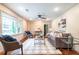 Sunlit living room boasts hardwood floors, a cozy layout, and decorative accents at 3219 W Manor Ln, Atlanta, GA 30311