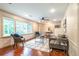 Bright living area featuring hardwood floors, fresh paint, and modern furnishings at 3219 W Manor Ln, Atlanta, GA 30311