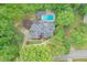 Overhead view of the property, showcasing its beautiful backyard pool and wooded surroundings at 3493 Wood Acres Blvd, Duluth, GA 30096