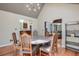 Dining room featuring a vaulted ceiling, skylights, and view of the kitchen and living room at 3493 Wood Acres Blvd, Duluth, GA 30096