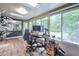 A sunny office with lots of windows, skylights, a modern desk and beautiful hardwood floors at 3493 Wood Acres Blvd, Duluth, GA 30096
