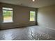Spacious bedroom with ample natural light from two large windows at 5522 Cosimo Rd, Fairburn, GA 30213