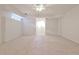 Large finished basement space with neutral carpet and ample lighting at 389 Mill Creek Ne Bnd, Atlanta, GA 30307