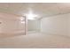 Carpeted basement with a large mirror and an open doorway to another room at 389 Mill Creek Ne Bnd, Atlanta, GA 30307