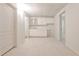 Finished basement with a wet bar, cabinets, and view into another room at 389 Mill Creek Ne Bnd, Atlanta, GA 30307