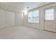 Large open basement featuring an exit door and a window for natural light at 389 Mill Creek Ne Bnd, Atlanta, GA 30307