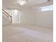 Spacious basement with carpet, stairs, and a small window providing natural light at 389 Mill Creek Ne Bnd, Atlanta, GA 30307