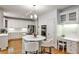 Modern kitchen with a center island, stainless steel appliances, custom cabinets, and a cozy desk area at 389 Mill Creek Ne Bnd, Atlanta, GA 30307