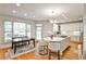 Spacious kitchen with an island, breakfast bar seating, and access to the dining area at 389 Mill Creek Ne Bnd, Atlanta, GA 30307