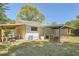 Backyard featuring covered patios, a fenced area, and mature trees at 4201 Regal Ridge Rd, Austell, GA 30106