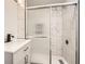 Beautiful bathroom featuring a glass-enclosed shower and a sleek vanity sink at 4201 Regal Ridge Rd, Austell, GA 30106
