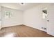 Well-lit bedroom featuring a closet and large windows with new flooring at 4201 Regal Ridge Rd, Austell, GA 30106