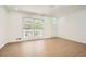 Bright living room featuring wood floors, recessed lighting and a large window at 4201 Regal Ridge Rd, Austell, GA 30106