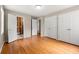 Bedroom with hardwood floors and ensuite bathroom at 6033 Morrow Cv, Morrow, GA 30260