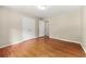 Bedroom with hardwood floors and ample closet space at 6033 Morrow Cv, Morrow, GA 30260