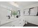 Modern bathroom with double sinks, sleek fixtures, and stylish decor in a clean, bright space at 6106 Marigold Way, Atlanta, GA 30349