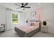 Charming bedroom features a plush bed, natural light, and stylish accents at 6106 Marigold Way, Atlanta, GA 30349