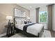 Comfortable bedroom featuring a plush bed, natural light, and stylish decor at 6106 Marigold Way, Atlanta, GA 30349