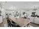 Elegant dining room open to living area features a stylish table and decor, creating a welcoming atmosphere at 6106 Marigold Way, Atlanta, GA 30349