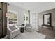 Cozy living room features neutral tones, lots of natural light and comfortable seating at 6106 Marigold Way, Atlanta, GA 30349