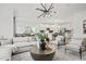Open-concept living room and kitchen is perfect for entertaining and features modern decor at 6106 Marigold Way, Atlanta, GA 30349