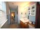 Stylish bathroom with neutral walls, vanity with mirror, and convenient access to an adjoining bedroom at 70 Darbys Crossing Ct, Hiram, GA 30141