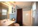 Bright bathroom with a vanity, shower-tub combination, and ample storage for a functional space at 70 Darbys Crossing Ct, Hiram, GA 30141