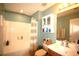 Well-lit bathroom featuring a shower with tub, ample storage, and a sink with vanity at 70 Darbys Crossing Ct, Hiram, GA 30141