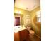 Cozy half bath with light green walls, wood floors, and a window for natural light at 70 Darbys Crossing Ct, Hiram, GA 30141