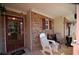 Cozy front porch features comfortable seating, brick accents, and a covered area for relaxation at 70 Darbys Crossing Ct, Hiram, GA 30141