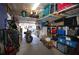 Organized garage with storage shelves, a motorcycle, and ample space for parking at 70 Darbys Crossing Ct, Hiram, GA 30141