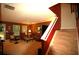Inviting living room with staircase, comfortable seating, and natural light from windows at 70 Darbys Crossing Ct, Hiram, GA 30141