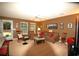 Spacious living room featuring a ceiling fan, comfortable seating, and a view of the backyard at 70 Darbys Crossing Ct, Hiram, GA 30141