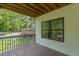 Inviting back porch overlooking a green yard and residential street with natural light at 1410 Eastland Rd Se Rd, Atlanta, GA 30316